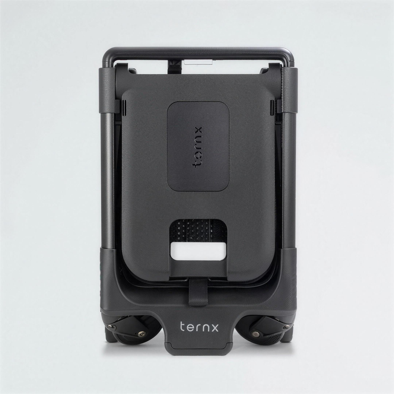 Back view of the TernX Carry On Luggage Stroller with telescopic handle and luggage compartment