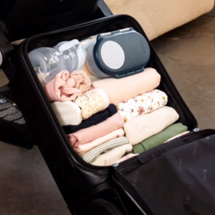 
Open TernX stroller packed with baby clothes and diapers
