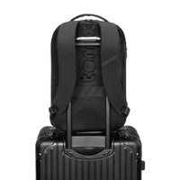 Thumbnail for TernX diaper bag sliding onto a suitcase handle via the trolley luggage pass-through sleeve