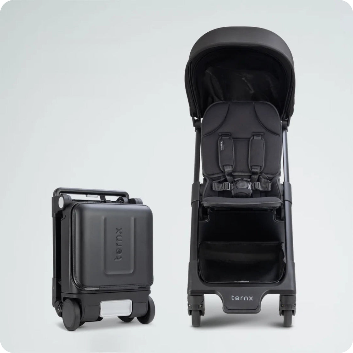 
TernX Carry-On hardshell and open stroller side by side
