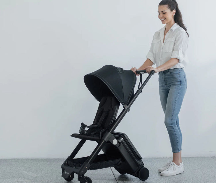 
Woman pushing the TernX stroller one-handed
